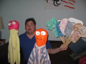 My brother, Ted, with some of the puppets he's made.