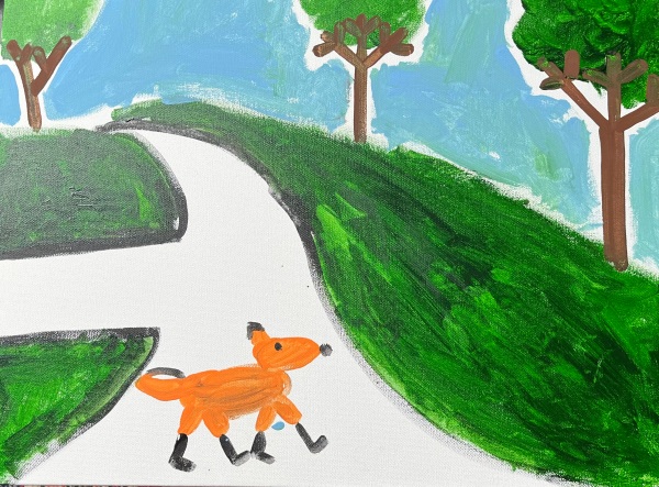 a orange fox crosses the road near a intersection in Philadelphia PA there is the intersection and a green hill and three trees and a blue sky